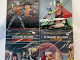 the covers of the comic books are lined up on a table