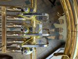 a close up of a brass instrument in a room