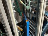 a room with a bunch of metal racks in it