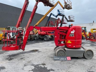 a picture of a red scissor is parked in a parking lot