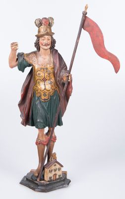 statue d'un homme tenant un drapeau rouge et un drapeau rouge