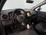the interior of a car with a steering wheel and dashboard controls