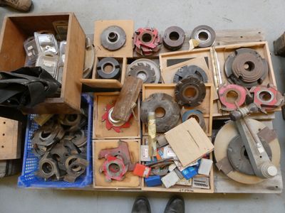 a box full of assorted tools on the floor