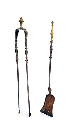 pair of antique iron and wood walking sticks with a bell on top