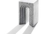 a small concrete table with a shadow on the ground