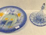 a blue plate and a glass bowl on a table