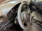 dashboard view of a car with a steering wheel and dashboard controls