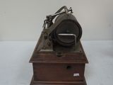 an old fashioned sewing machine sitting on top of a wooden box