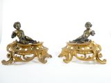 pair of antique bronze figurines of a boy and a girl sitting on a bench