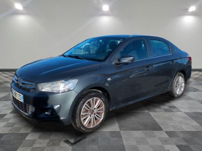 a picture of a blue car parked in a garage