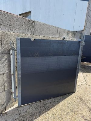 a metal door that is on the side of a building