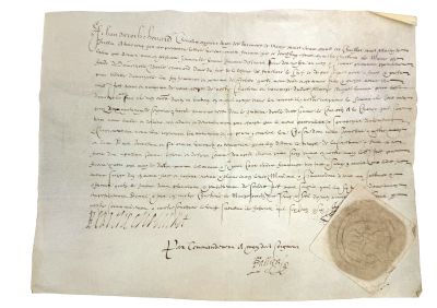 un gros plan d'une feuille de papier portant un cachet de cire