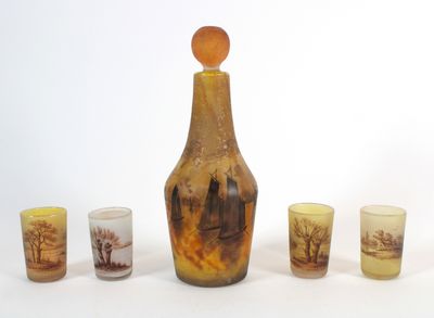a bottle and glasses with a picture on it