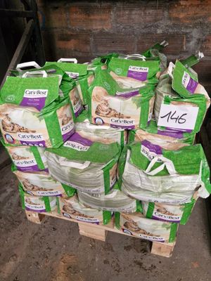 many bags of food sitting on a pallet