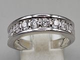 a white gold ring with diamonds on a white background