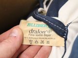 a person holding a label that says draloon on it