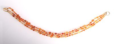 necklace made of orange glass beads with a gold plated clasp