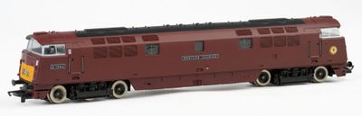 a toy train on a white surface with a white background