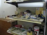 a shelf that has many items on it in a room