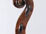 an old violin with a wooden bow on a white background