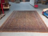 a large rug on the floor in a warehouse