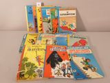several children ' s books are lined up on a table