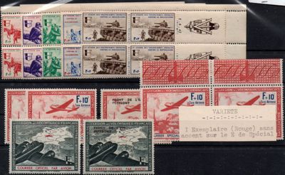 several stamps from different countries are on display on a black surface