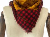 chanel red and black checkered scarf on mannequin torso
