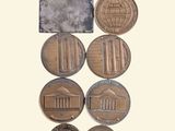 a lot of coins that are sitting on a table