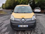 a small yellow van parked on the side of the road