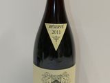 a bottle of wine that is sitting on a table