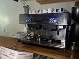 a coffee machine sitting on top of a wooden table
