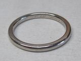 a close up of a silver ring on a white surface