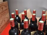 several bottles of red wine are lined up in a wooden crate