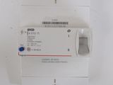 a close up of a white electrical device on a white surface