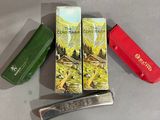 three different types of swiss army knives on a table