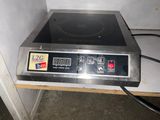 an image of a stove top with a digital display on it