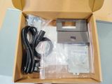 a box with a printer and a charger inside of it