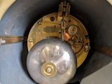 a close up of a clock that is on a table