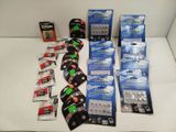 many different types of batteries and batteries on the table