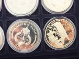 six different coins are in a black box on a table