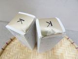 two boxes that are sitting on top of a table