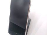 a cell phone that is sitting on top of a stand