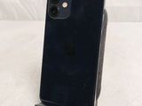 an image of a close up of a cell phone on a stand