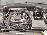 a picture of a car engine with its hood open