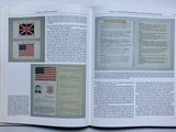 an open book with a picture of a british flag on it