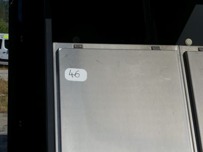a refrigerator that is sitting in the back of a truck