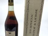 an image of a bottle of wine sitting next to a cardboard box