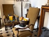 two chairs and a table in a room with a checkered floor