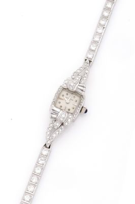 a lady ' s watch with diamonds on a white background